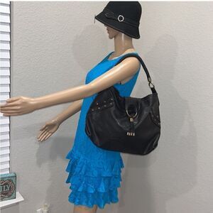 Vintage Cole Haan pebbled black leather bag, with gold toned hardware.